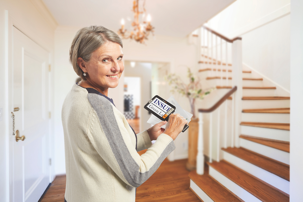 A woman using the Explore 5 to read her mail.